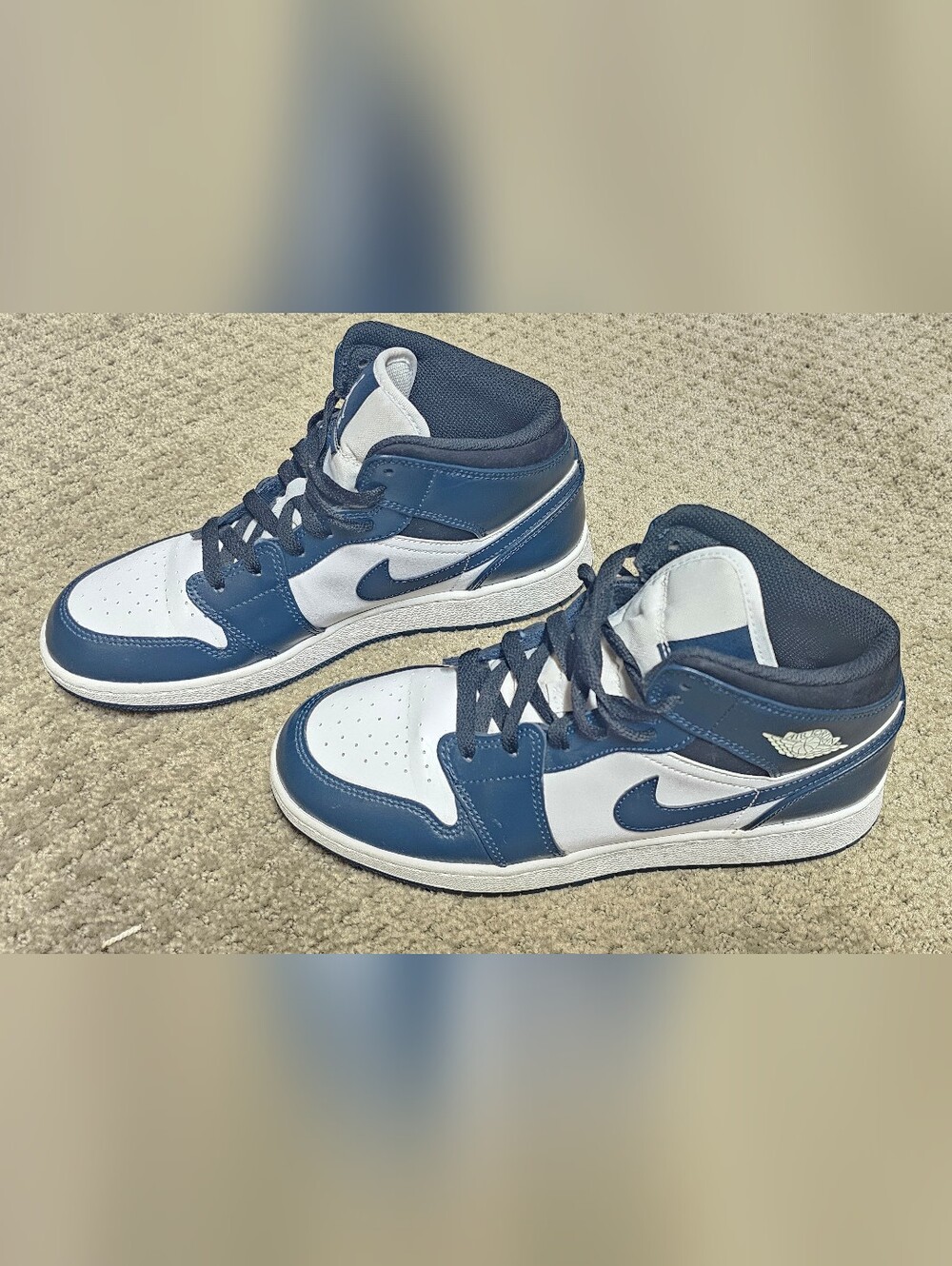 Jordan Menโs Mid-Top Sneakers in Navy and White